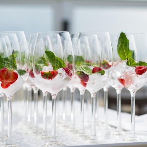 Cocktail glasses with strawberries and ice at a ceremonie